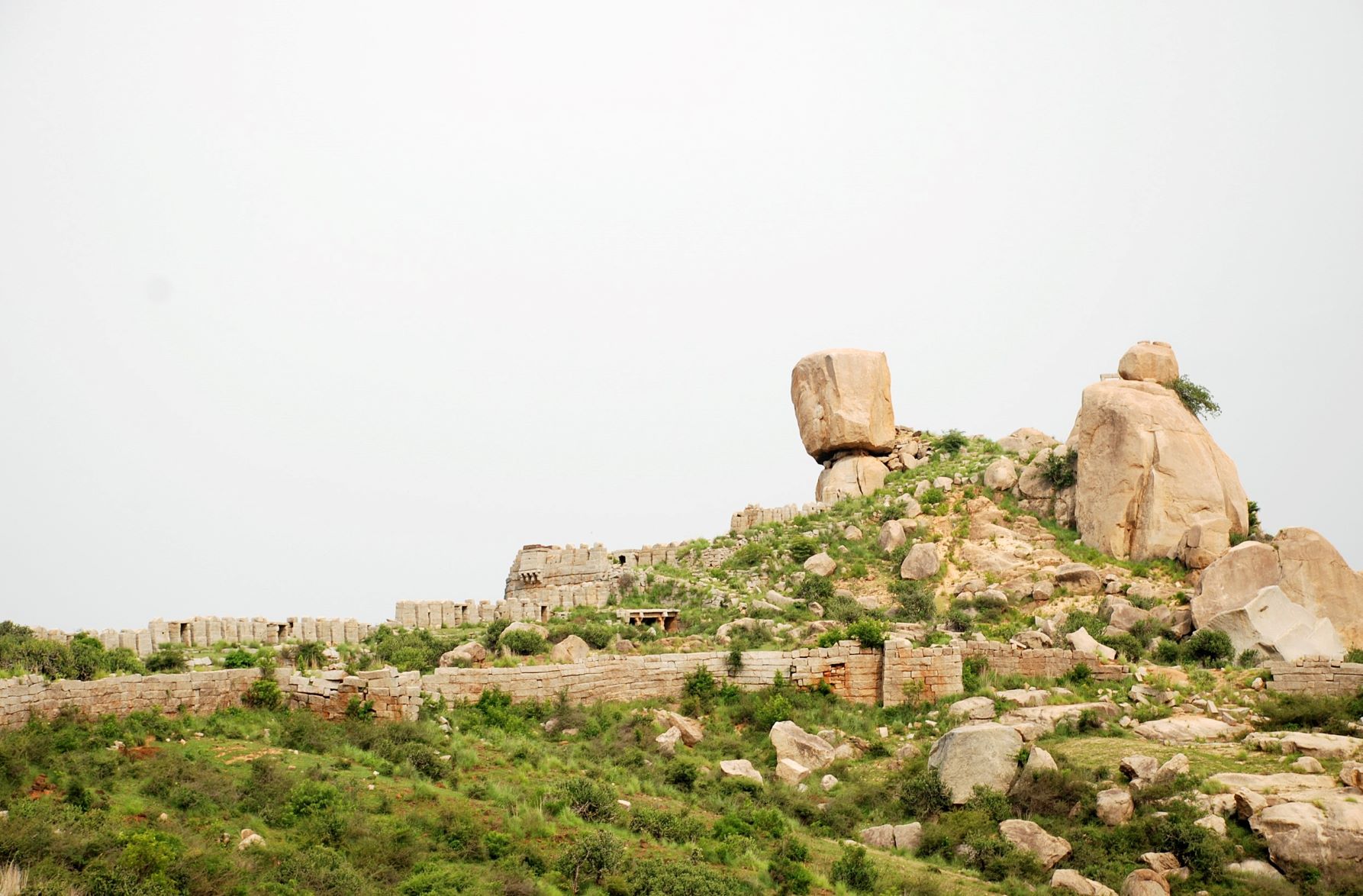 A view of the rocky outcrop and stone defense wall, Image Source: Archaeological Survey of India.